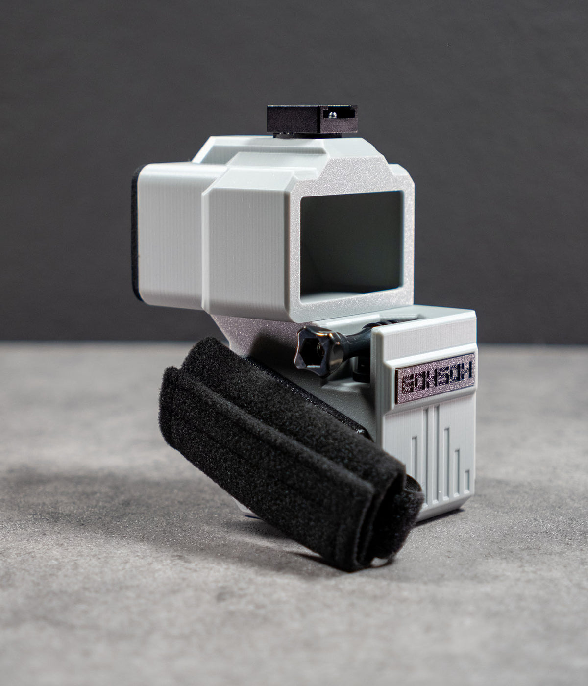 Rear view of Mini 60 showing the optical viewfinder and side-mounted hand strap