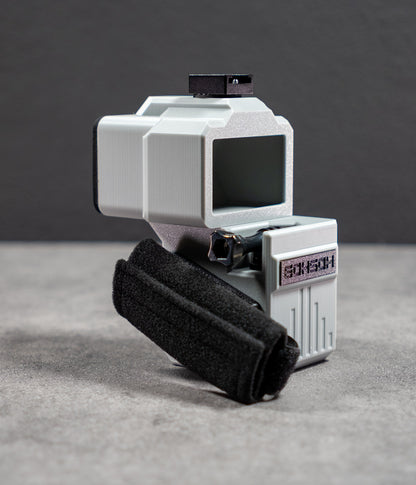 Rear view of Mini 60 showing the optical viewfinder and side-mounted hand strap