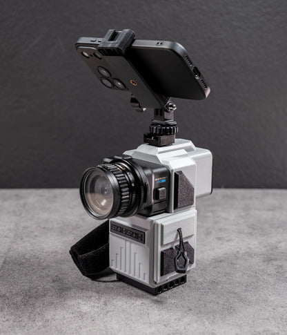 Mini 60 camera housing with smartphone mounted horizontally above the optical viewfinder