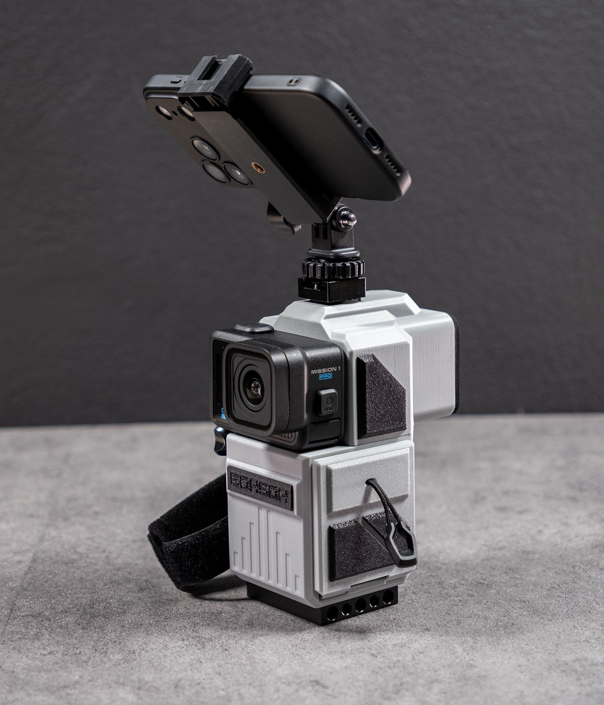 Side view of Mini 60 with GoPro Mission 1 and smartphone mounted on top