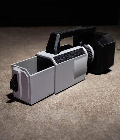 Rear slide-out accessory compartment on the Mini VX™ with cable passthroughs for charging or SSD recording.