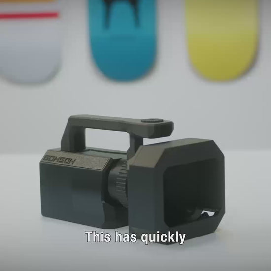 Mini VX™ camera rig in hand showing lightweight VX1000-inspired grip for skate filming.