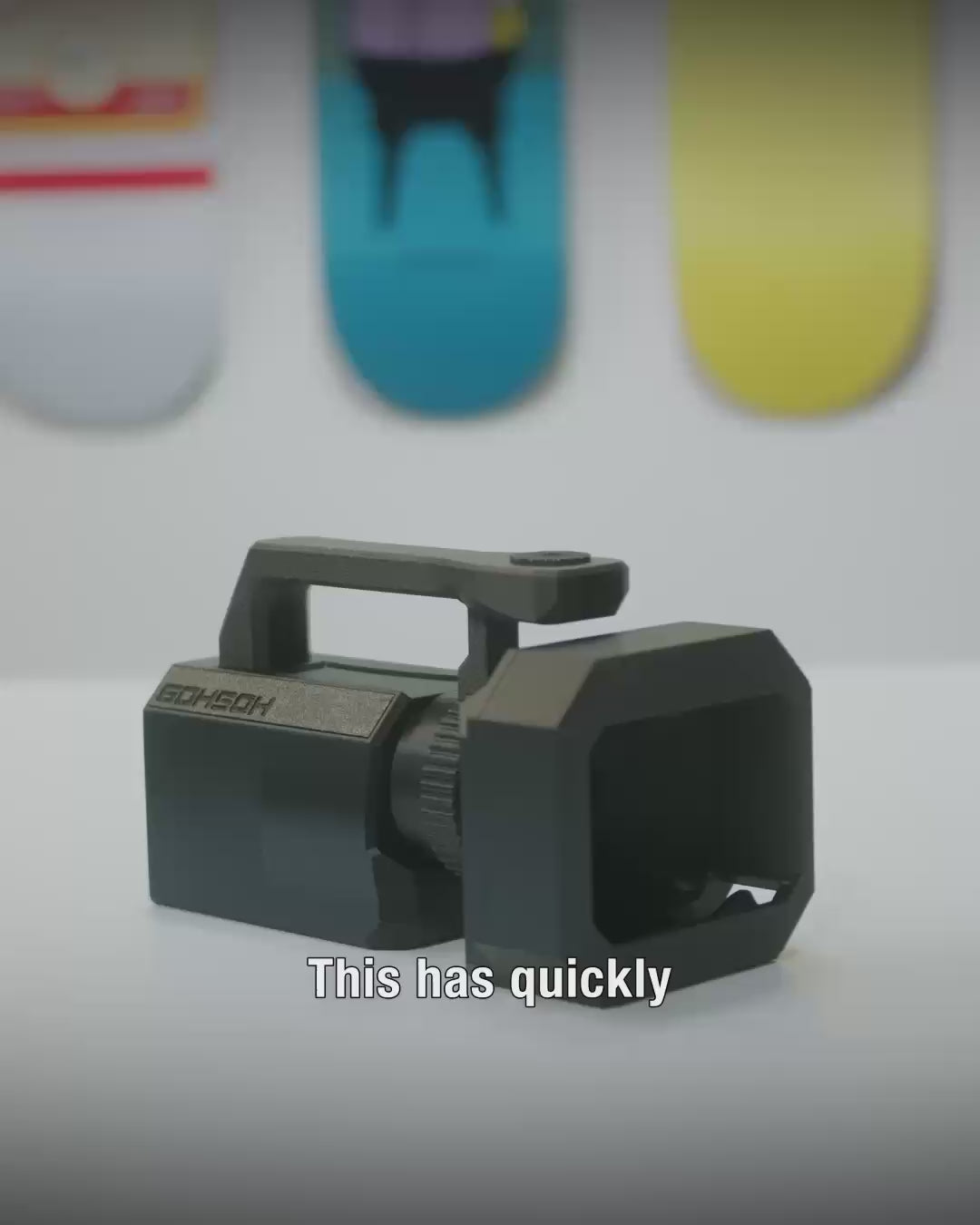 Mini VX™ camera rig in hand showing lightweight VX1000-inspired grip for skate filming.