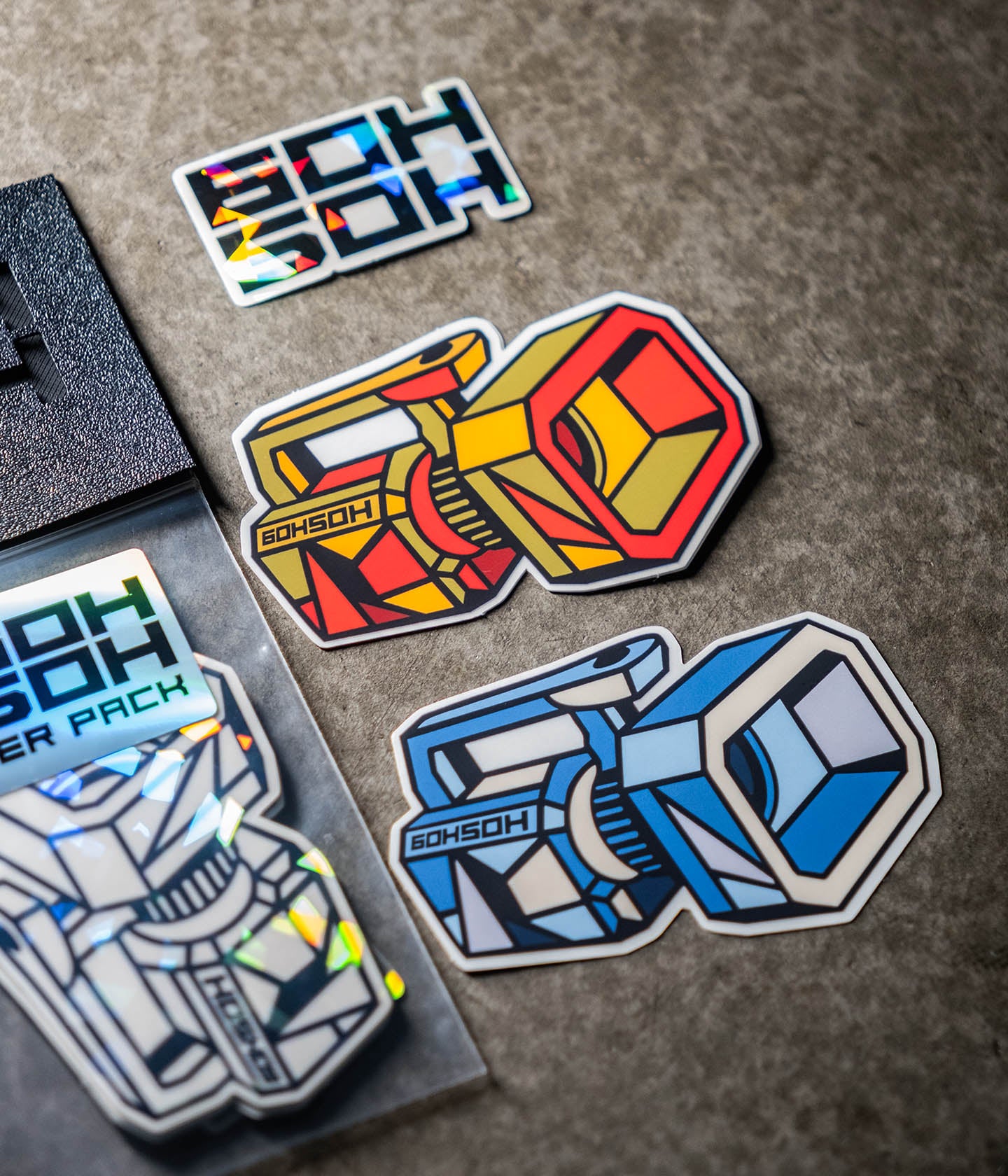 Clear vinyl Mini VX™ stickers with bold colorways and hand-drawn line artwork.